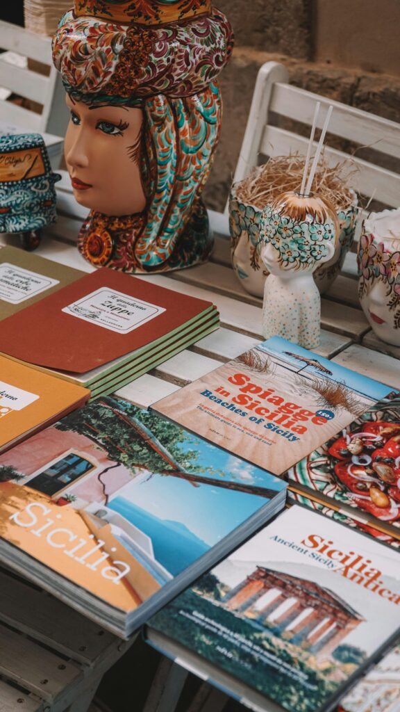 pexels photo 17467010 17467010 Vibrant display of Sicilian ceramics and literature in Sirakusa, Italy.